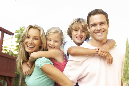 Portrait of Happy Family In Garden