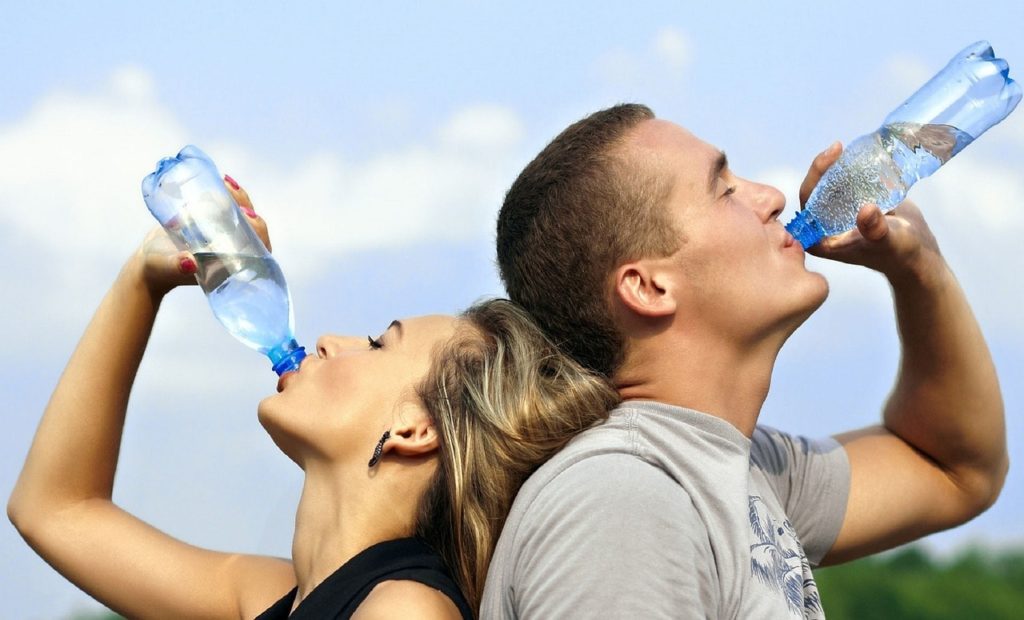 Drink plenty of water to keep cool when waiting for the 24-hour air conditioning repair technician.