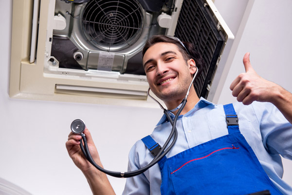 HVAC technician performing an cooling repair