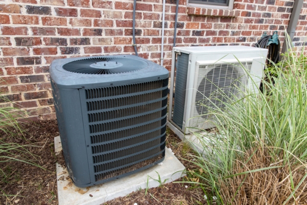 Outdoor AC unit depicting poor maintenance