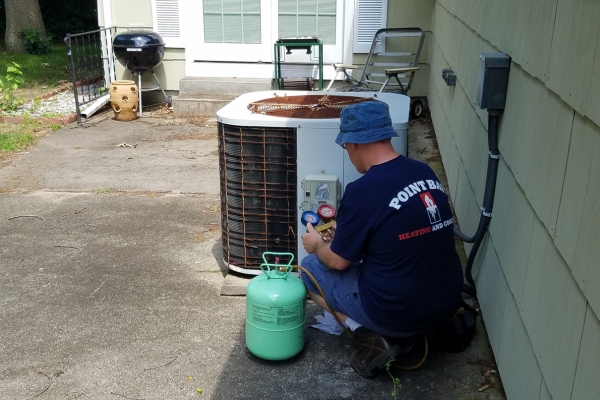 Point Bay Fuel technician attending to AC refrigerant issues