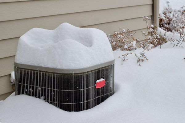 air conditioner covered in snow