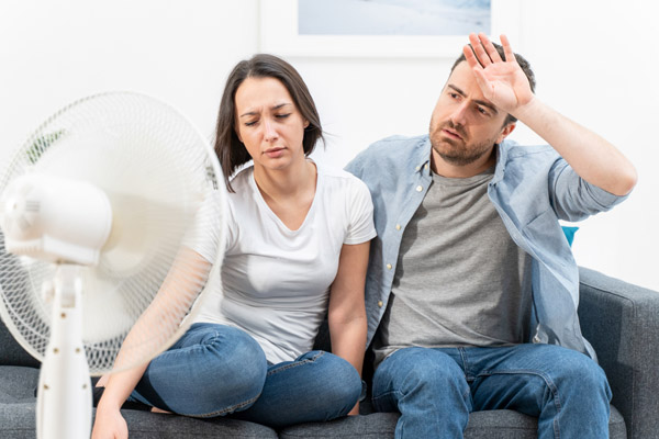 couple dealing with high humidity and discomfort