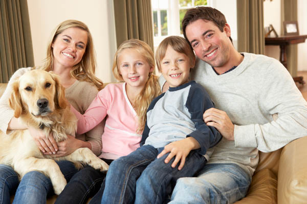 family at home in winter depicting comfortable furnace heating system