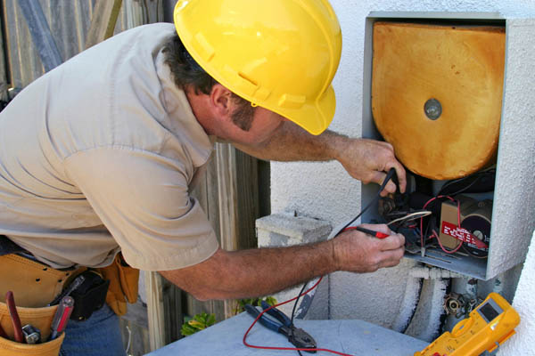 hvac contractor repairing an hvac system