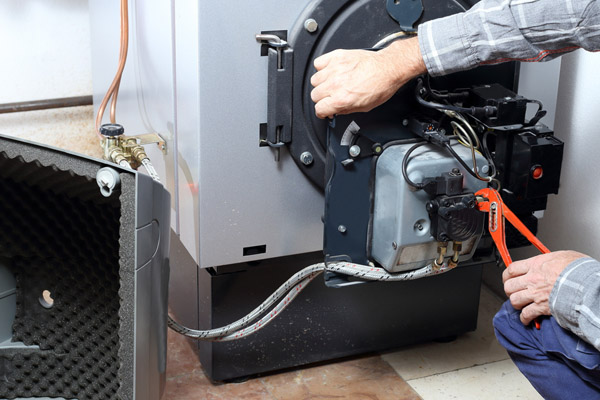 image of a boiler that is experiencing water leaking from boiler