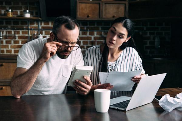 image of a couple calculating bills and home heating