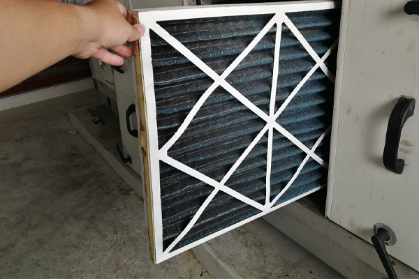 image of a heat pump filter that is dirty