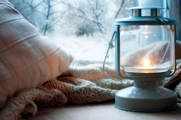 image of a home using candles for heat during a power outage