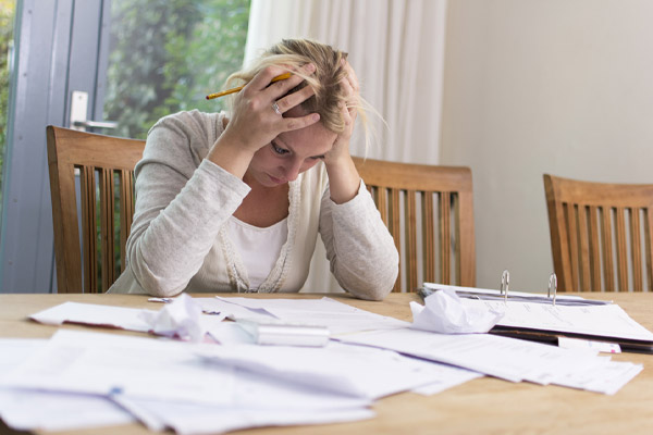 image of a homeowner dealing with high cooling costs