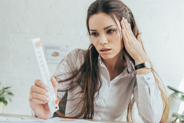 image of a homeowner experiencing a heat pump not cooling