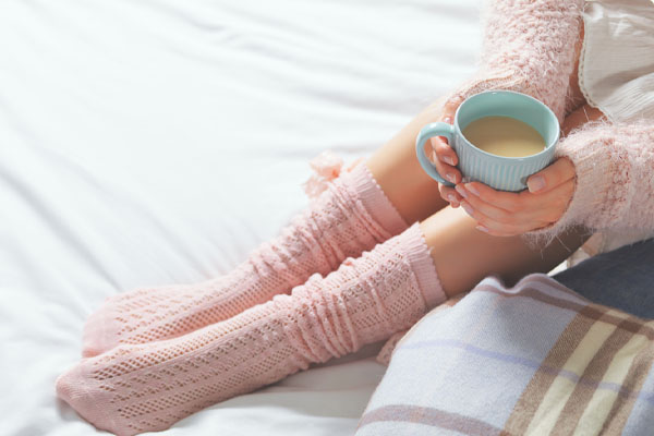 image of a homeowner relaxing at cozy home atmosphere in winter and ductless mini-split