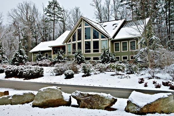 image of a house in winter that uses heating oil