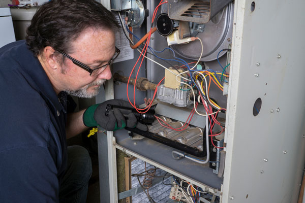 image of a hvac contractor performing a furnace installation