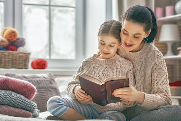 image of a mother and daughter feeling comfortable due to boiler home heating system