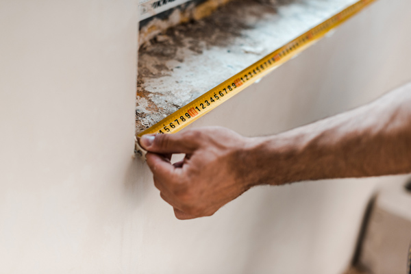 image of a person remodeling for a central AC installation