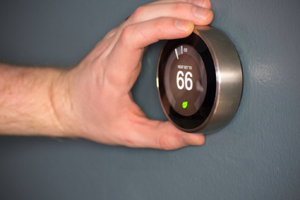 image of a smart thermostat for hvac system performance