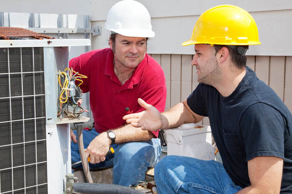 image of an air conditioner compressor repair