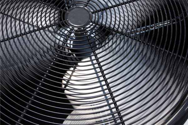 image of a heat pump fan and condenser