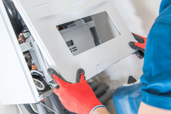 image of an hvac contractor performing a furnace repair