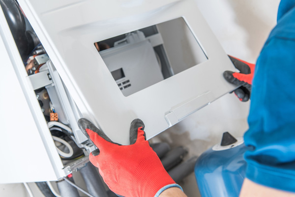 image of an hvac contractor performing a furnace tune-up