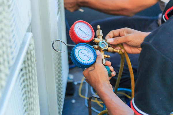 image of an hvac contractor performing air conditioner installation