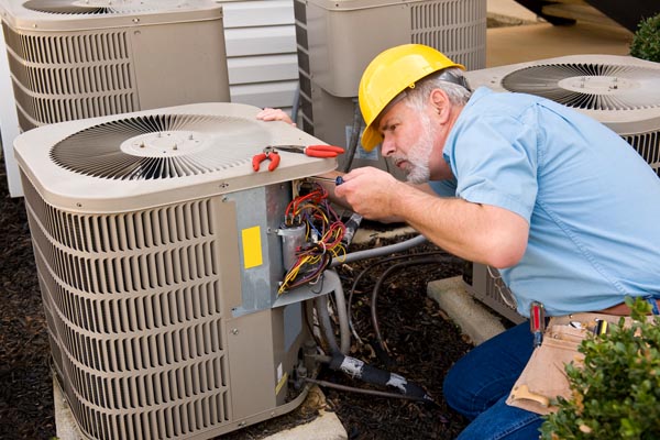 hvac contractor performing air conditioner tune-up