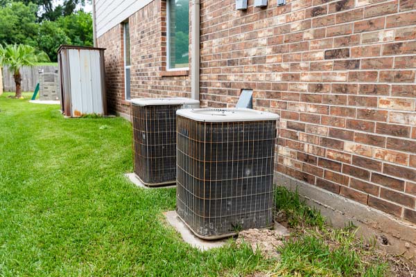 image of an outdoor air conditioning unit in summer