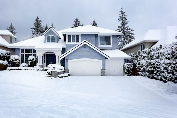 image of house in snow depicting home heating in winter