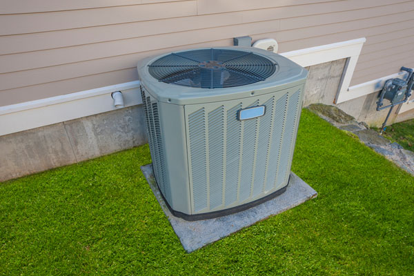 image of outdoor heat pump with a leak