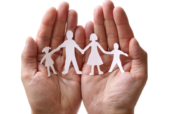 image of paper cut out of family in hands depicting heating system venting