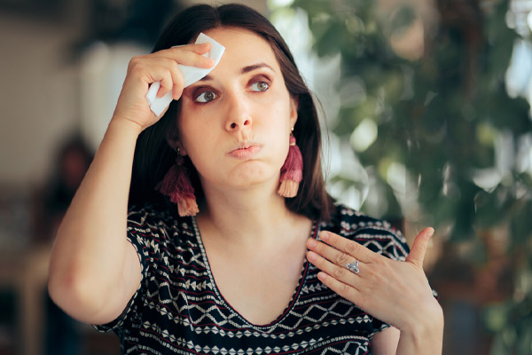 imahe of a home buyer feeling hot with air conditioner