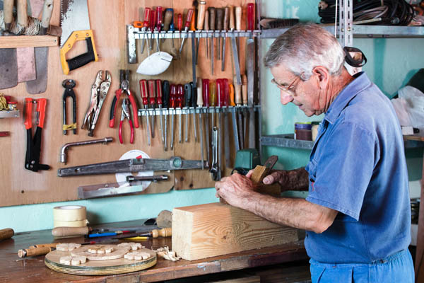 man working in garage with ductless mini-split