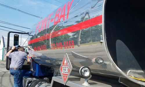 oil truck driver entering fuel delivery truck in ocean county nj