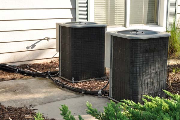 Two outdoor central air conditioner units
