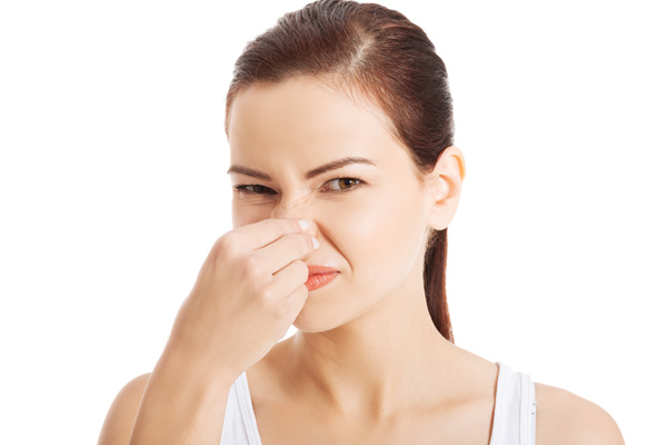 woman dealing with a heating oil smell in her house